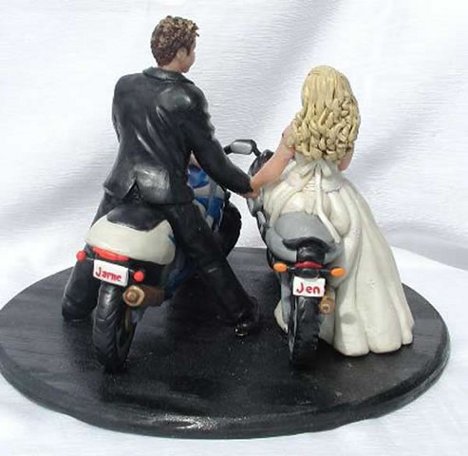 Here is a very patriotic cake topper each of the wedding couple proudly